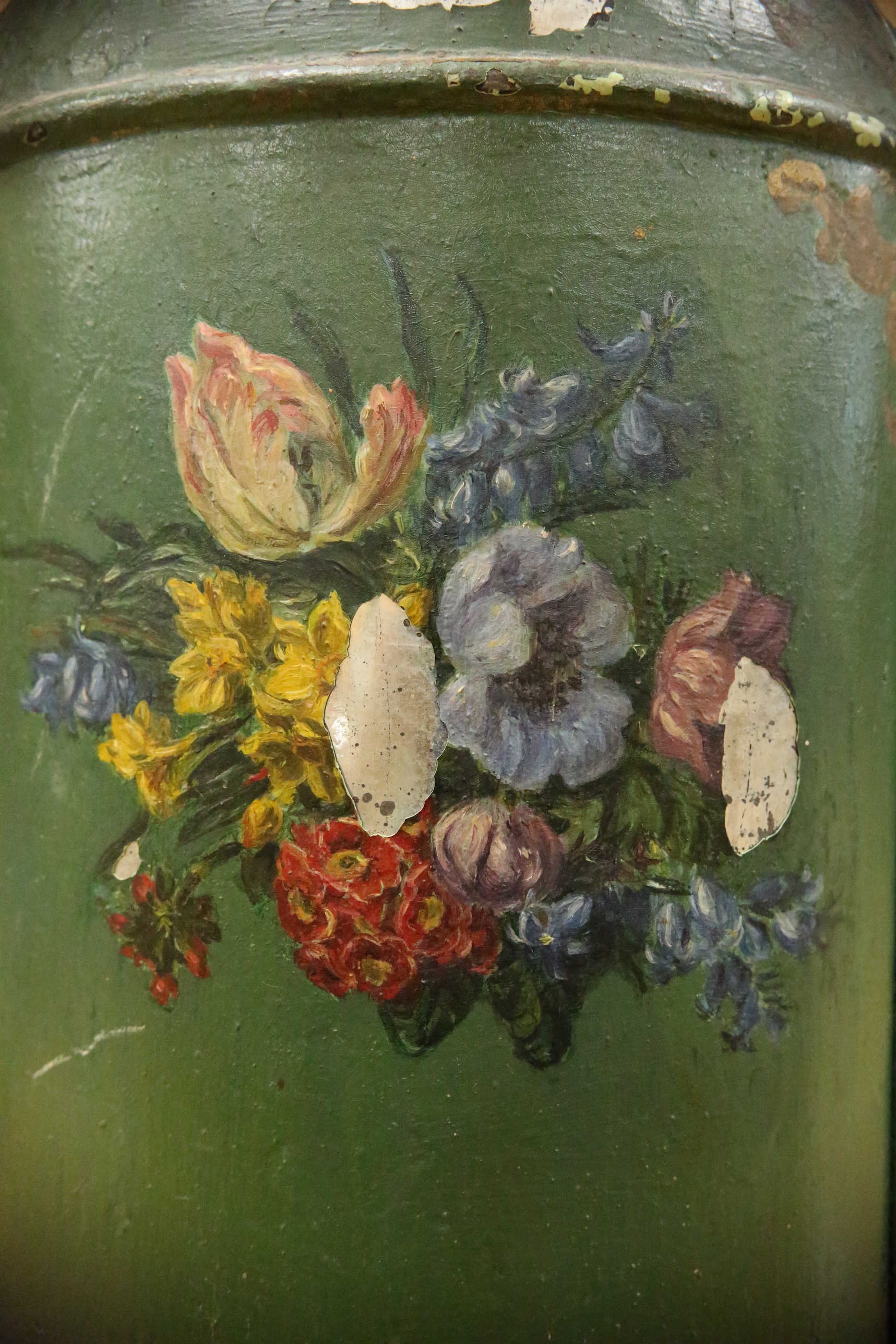 A green toleware floral decorated tea canister, 42cm high. Condition - poor, many chips to surface paint